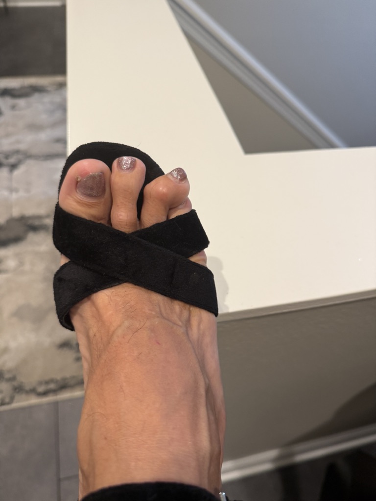 Foot in black sandal near stairs
